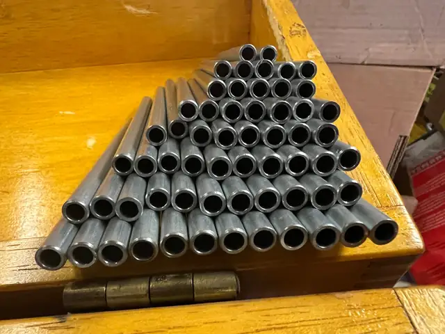 Stack of cut and deburred coated steel tube blanks
